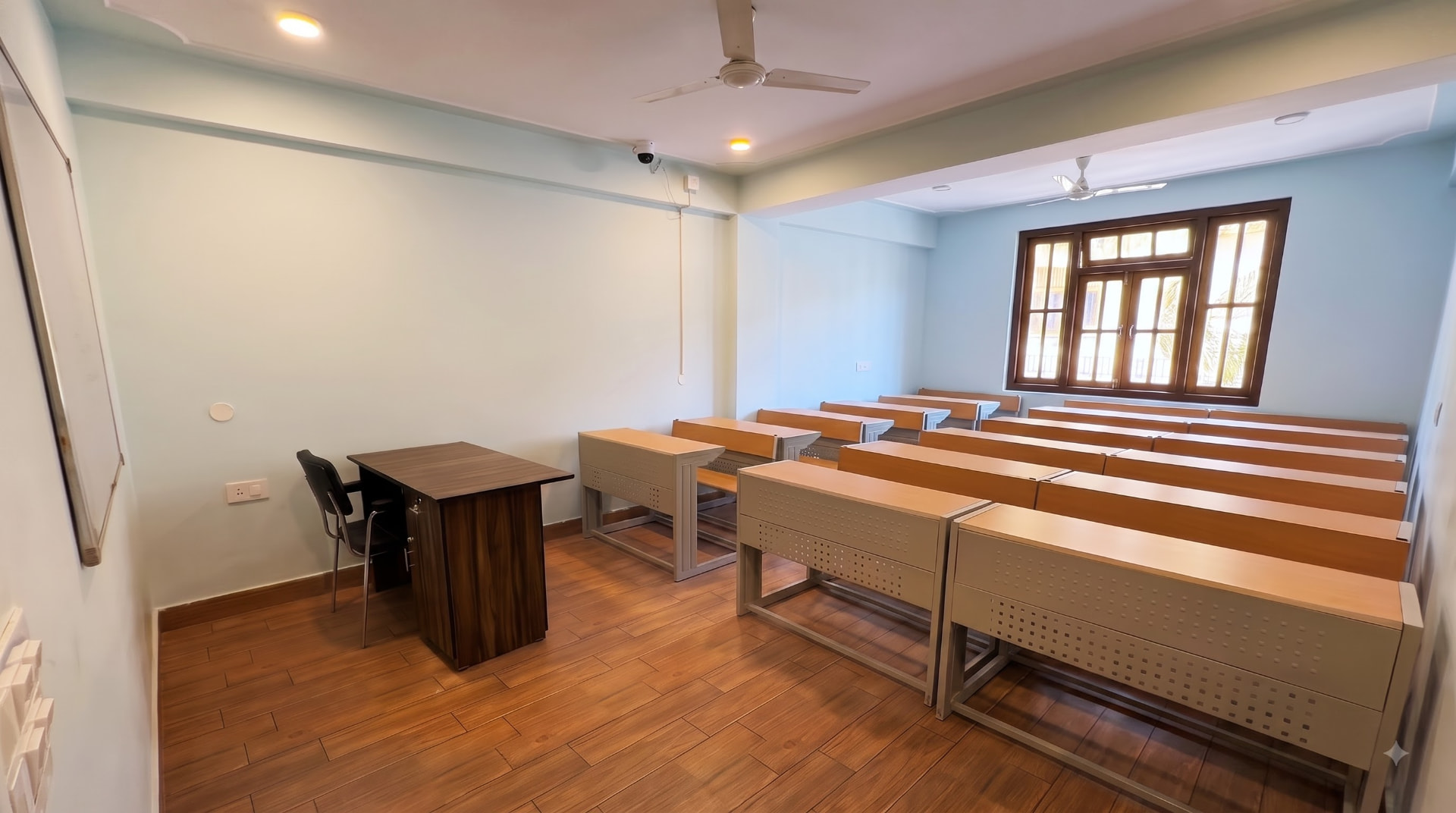 Tiered lecture hall with faculty desk